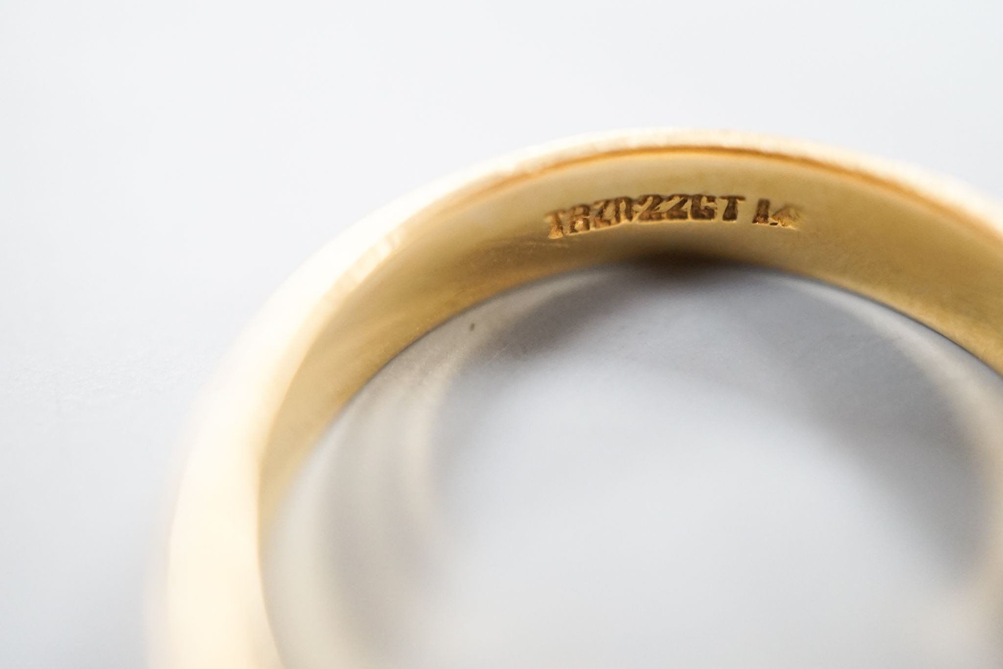 A 22ct wedding band, size N, 4.3 grams.